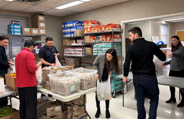 Employees preparing food packages