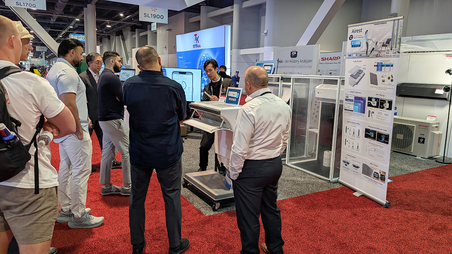 Photo of visitors at the Sharp booth